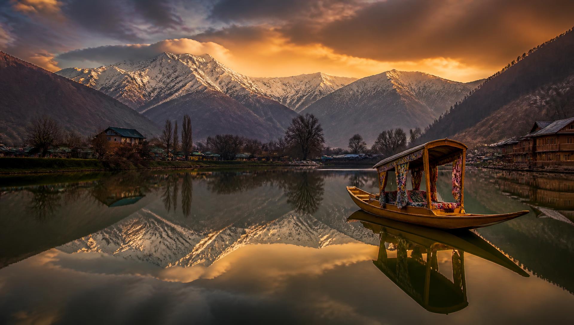 Shikara boat on a Kashmir lake below snow peaks